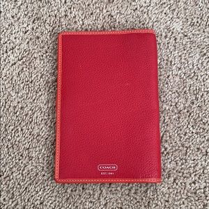 Red coach passport holder.